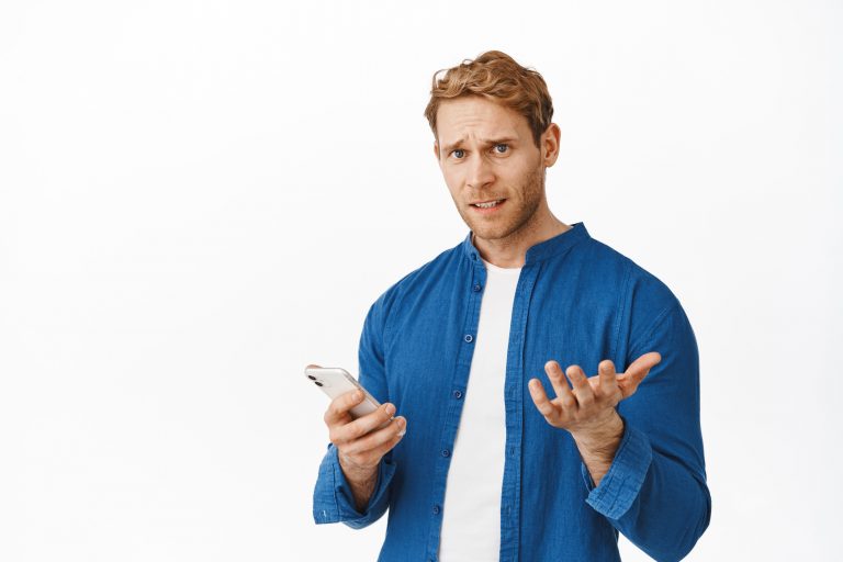 what-is-this-confused-annoyed-redhead-man-cant-understand-holding-smartphone-looking-puzzled-camera-strange-message-dont-know-how-use-application-standing-white-background-min.jpeg